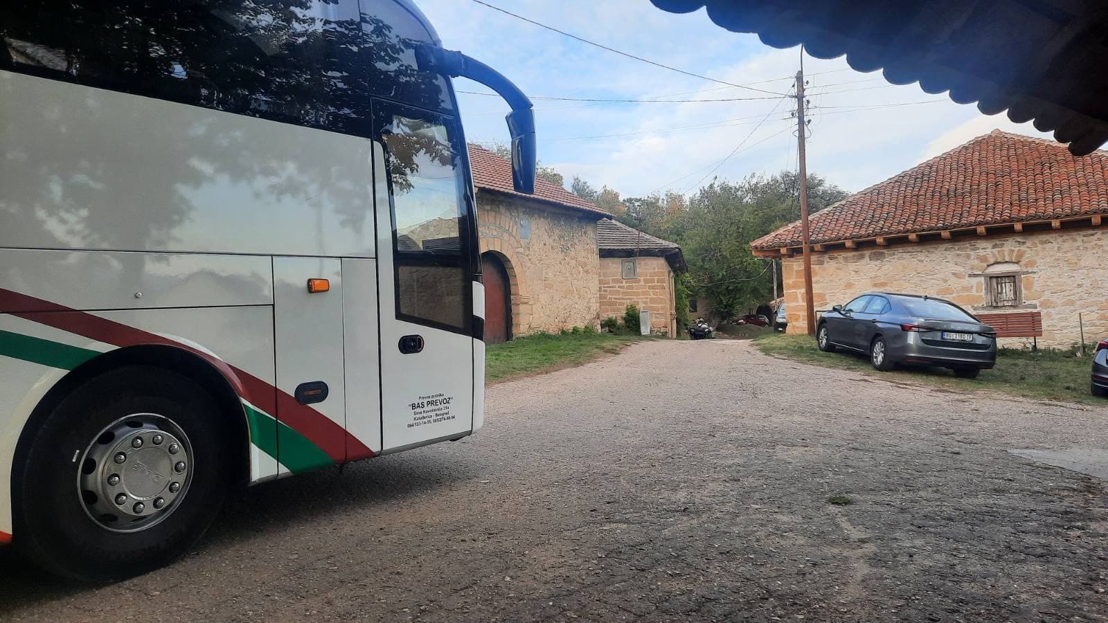 Front of the coach in a monastery courtyard