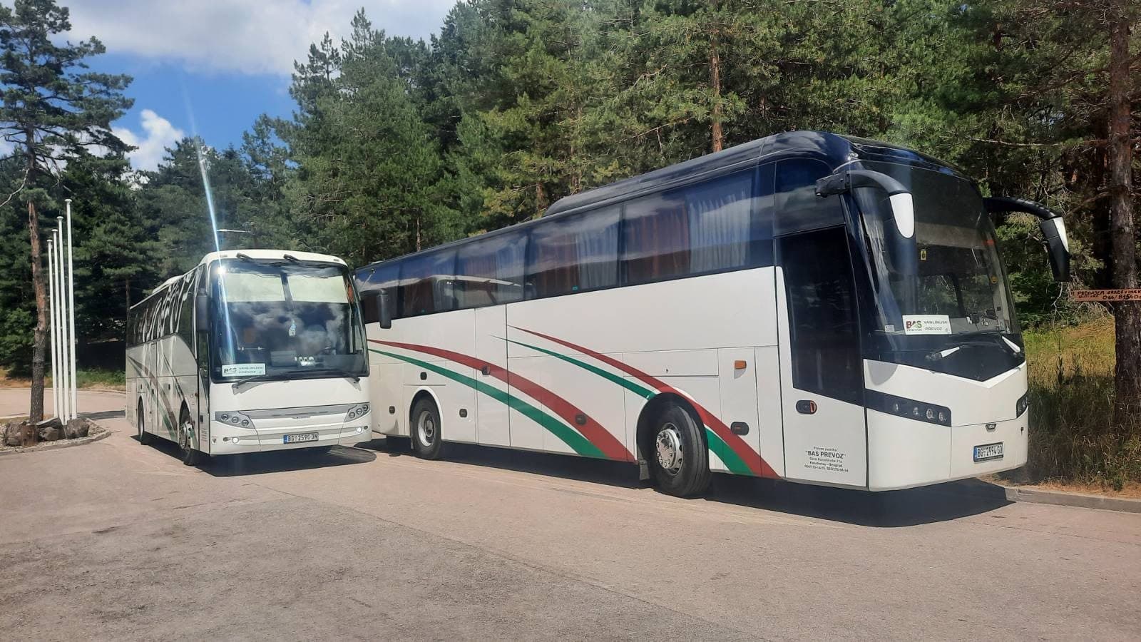 White BAS PREVOZ coach in front of trees