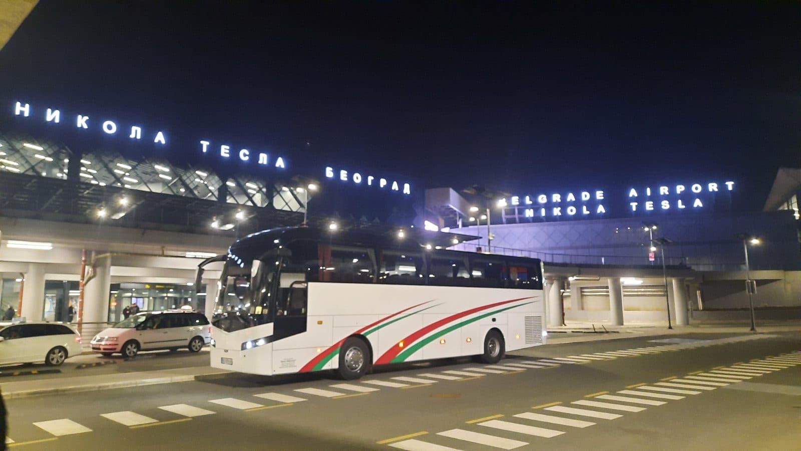 Coach outside Nikola Tesla Airport at night