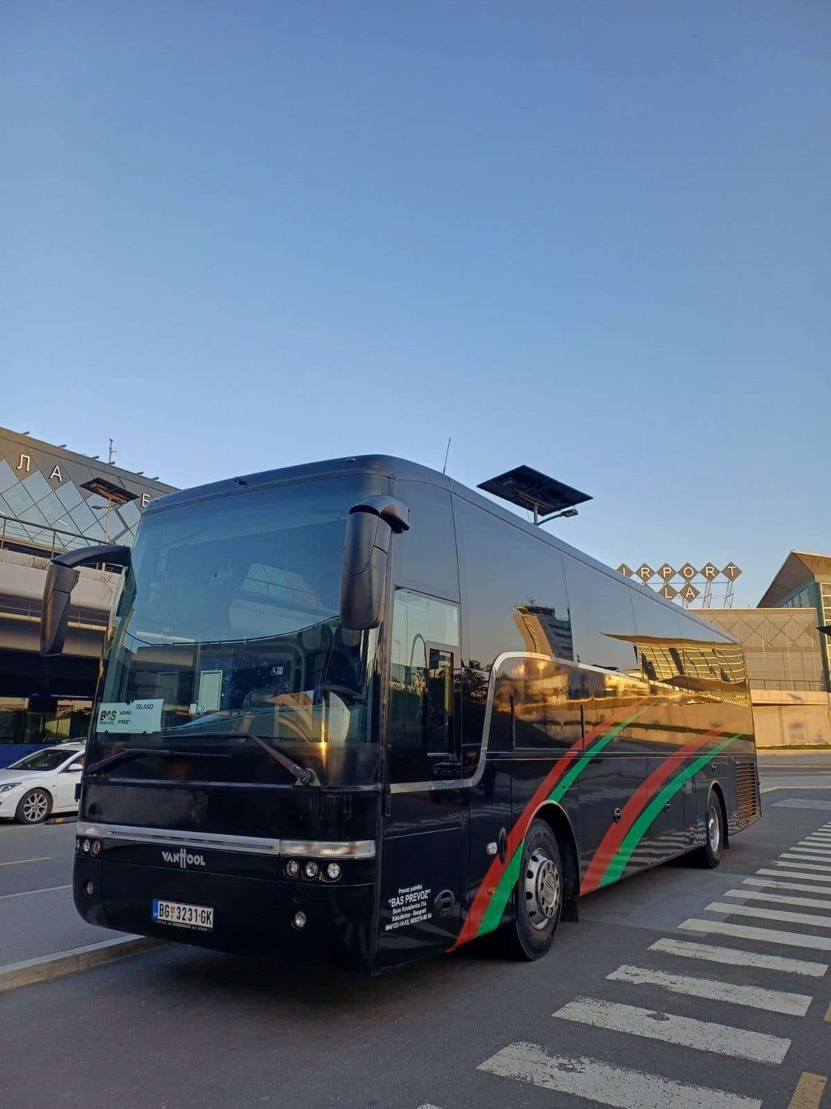 Black Van Hool coach outside Nikola Tesla Airport
