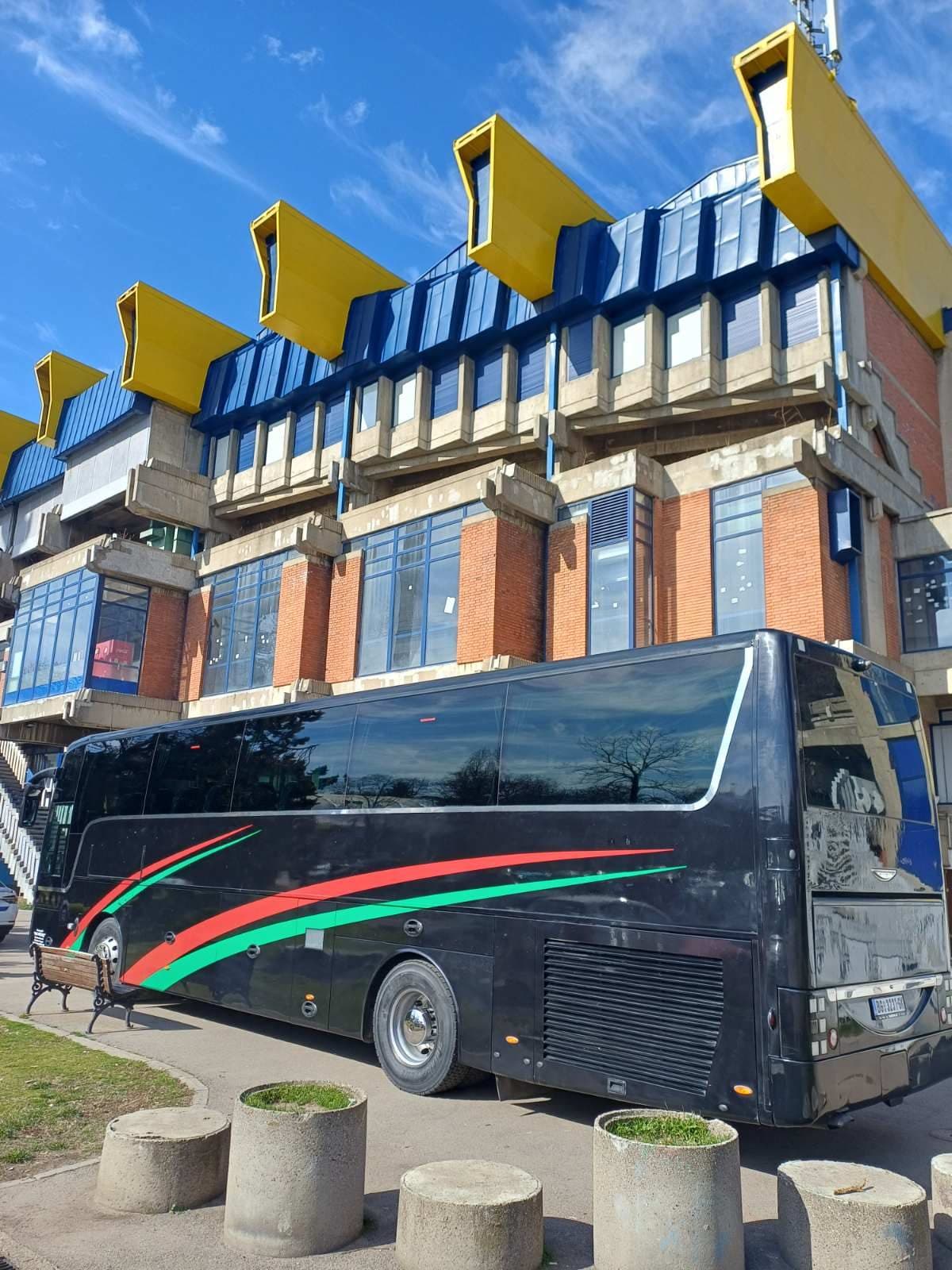 Black Van Hool coach, rear view