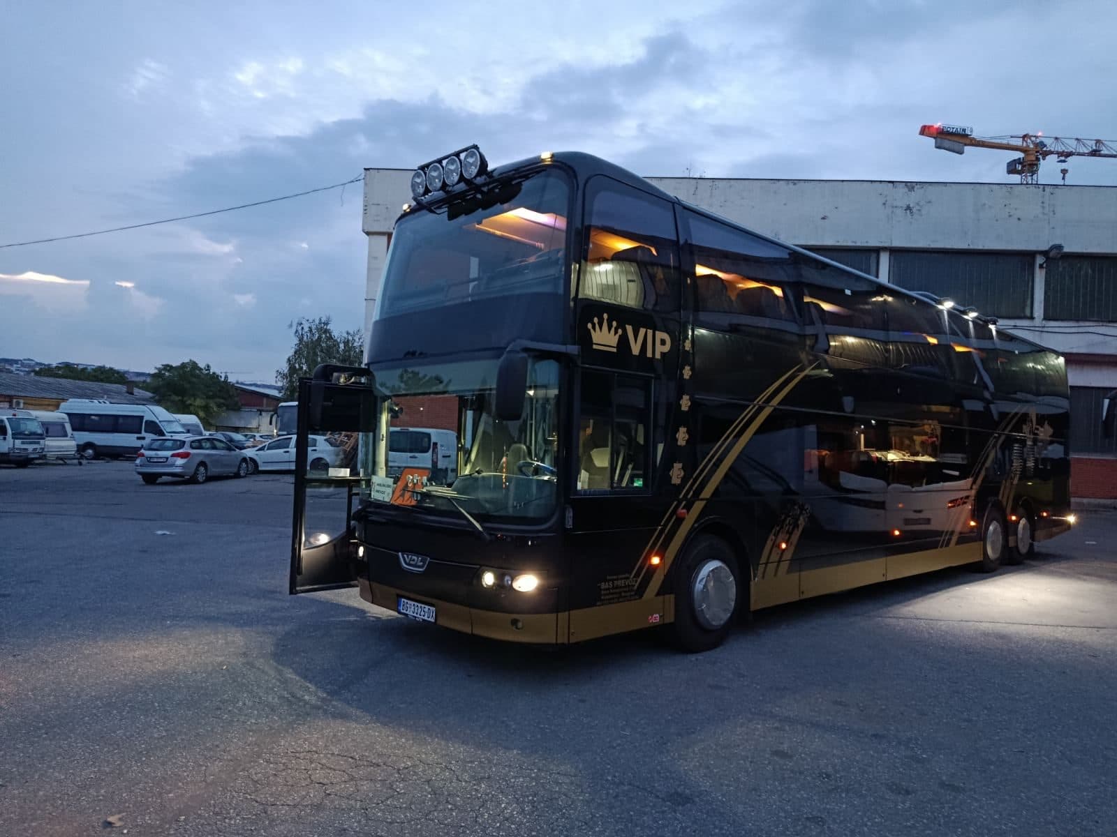 VDL Synergy VIP at dusk with the door open and lights on