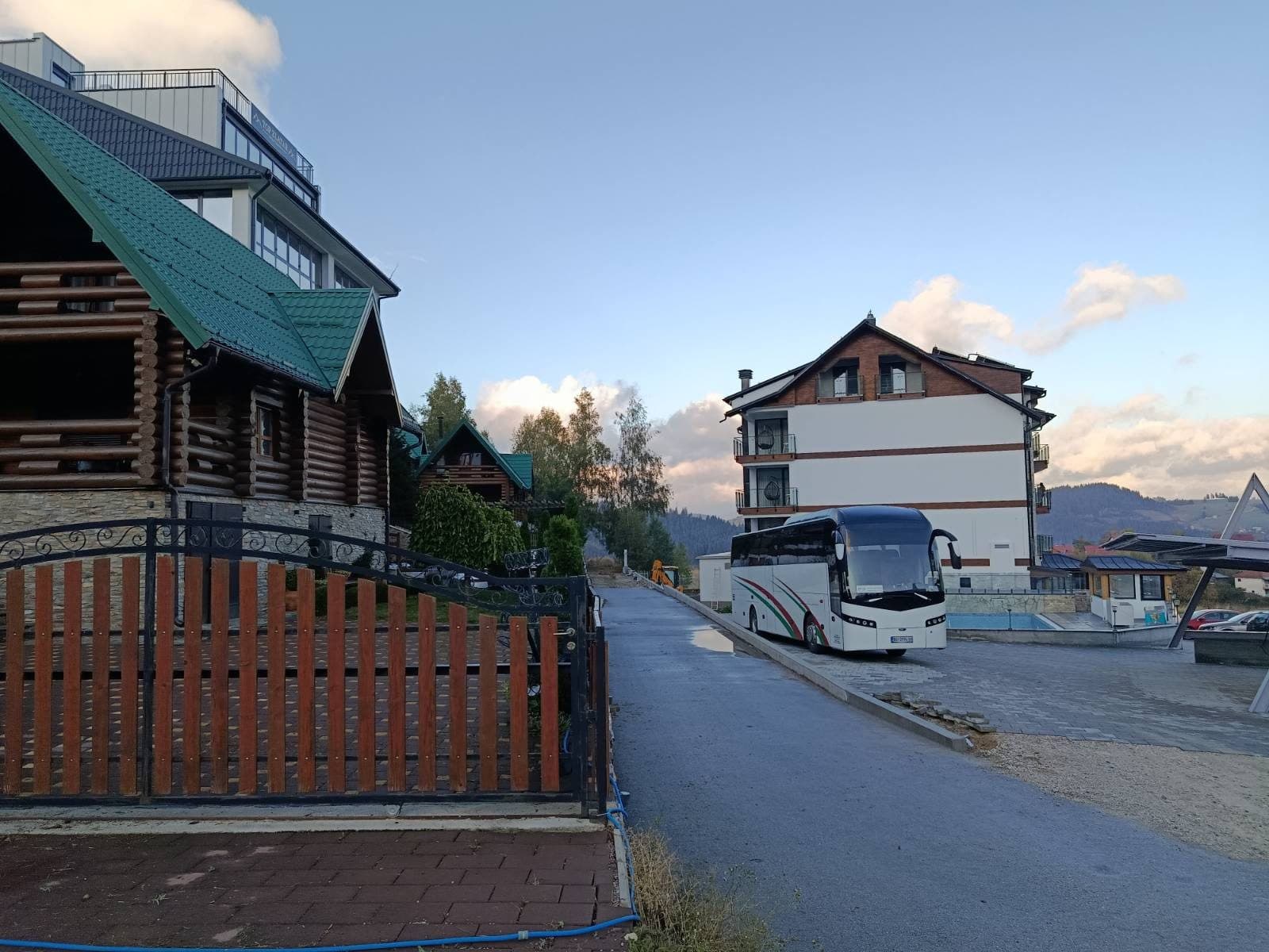 White coach outside a mountain resort