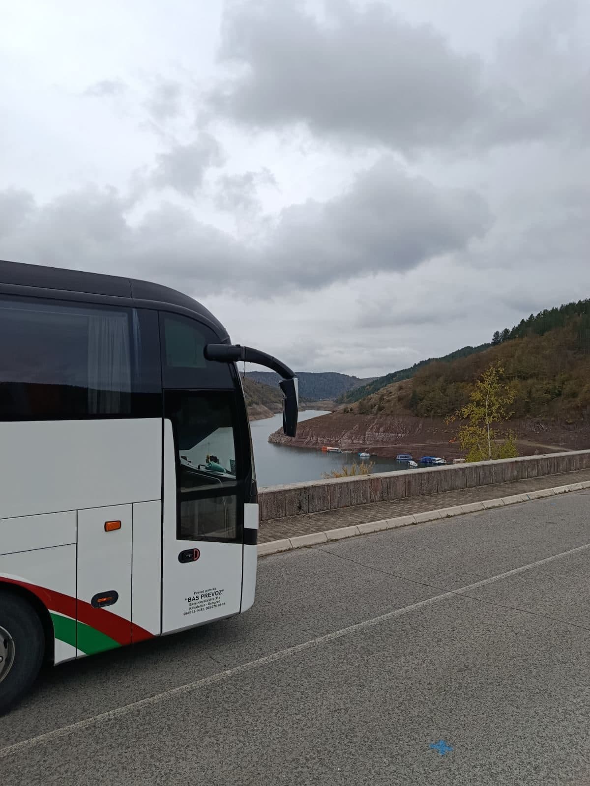 White BAS PREVOZ coach above Lake Uvac